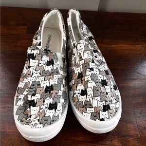 Cynthia Rowley Cat Patterned Slip-Ons in Black, White, and Tan